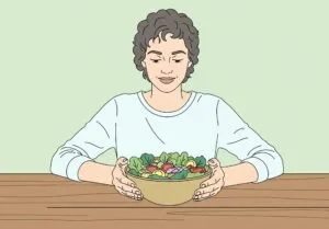 Ilustración de una persona practicando la alimentación consciente, sentada tranquilamente frente a su ensalada sin distracciones para reconectar con su cuerpo.
